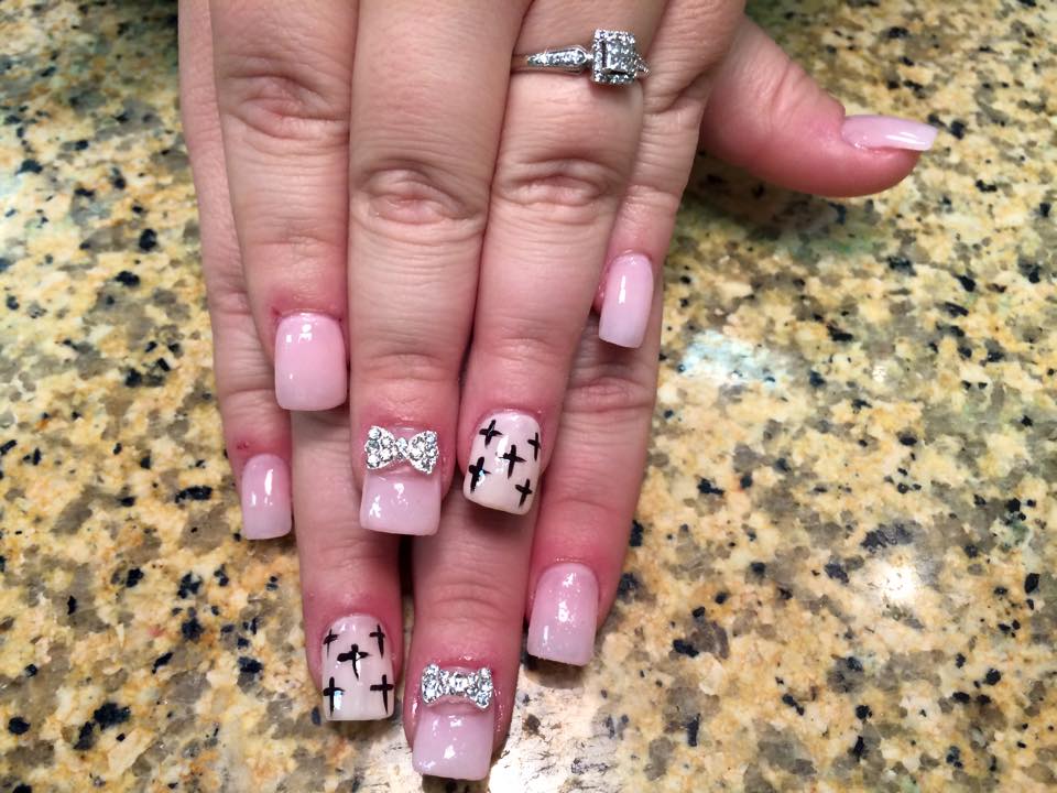178.jpg Opaque pink nail, with black crosses OR sparkly/diamond bowtie. - 178.jpg